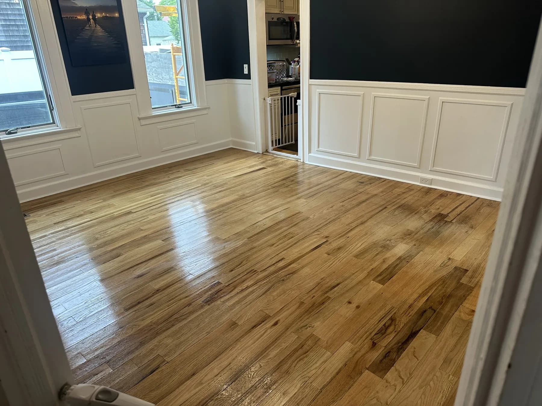 Residential flooring installation with finished surface and transitions